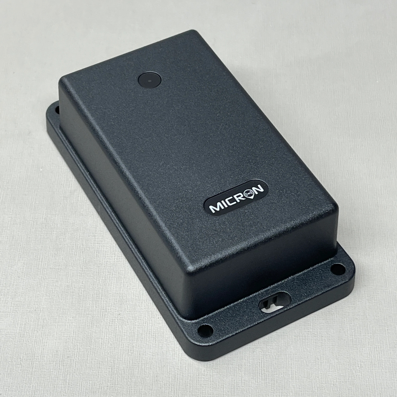 Photo of the front of a GPS tracker, with the Micron wordmark